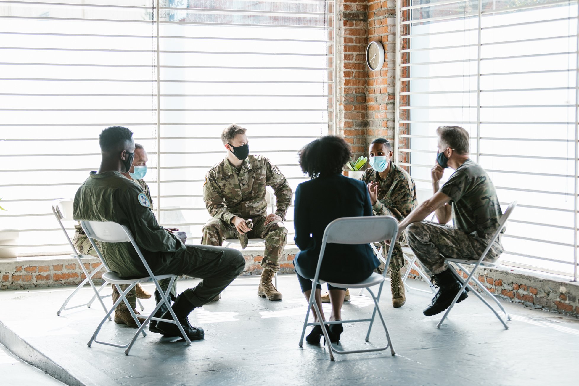 Photo of Group of People Sitting on Folding Chairs